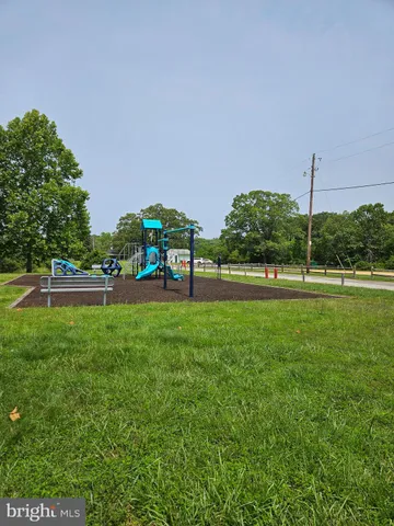 a view of a park with swings and slides