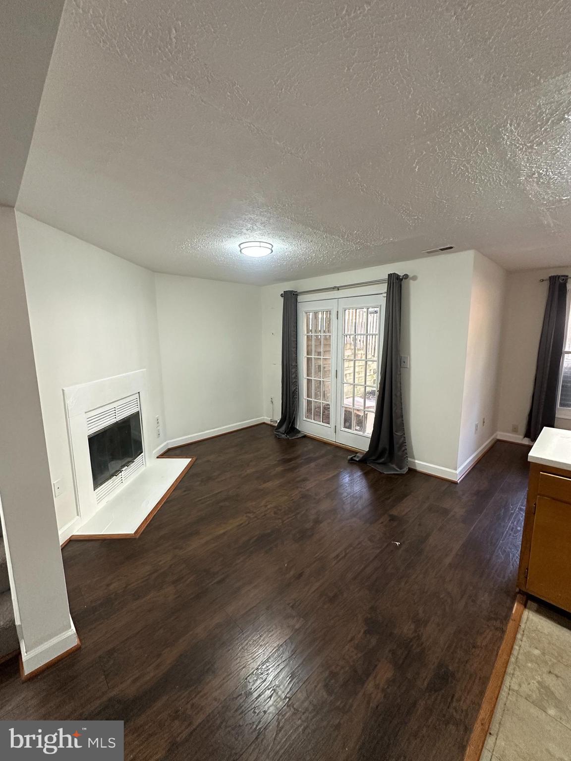 7 Drumcastle Court Germantown, MD 20876 - Photo 13 of 17 an empty room with wooden floor and windows