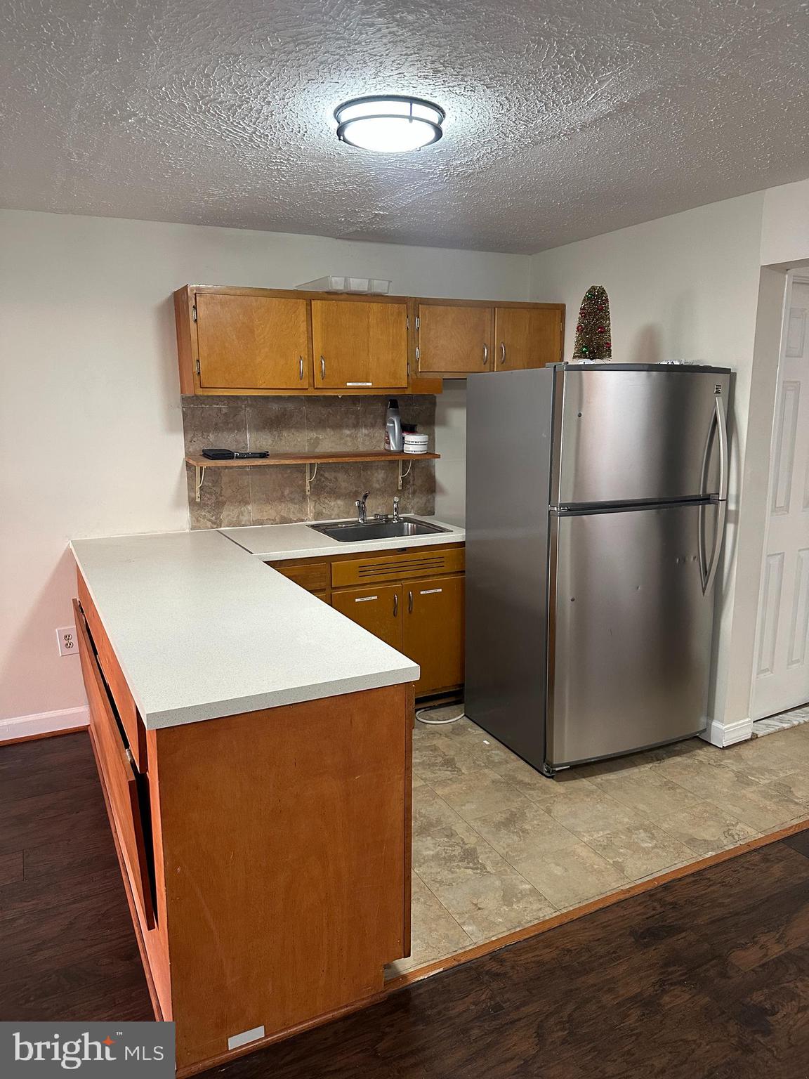 7 Drumcastle Court Germantown, MD 20876 - Photo 14 of 17 a kitchen with stainless steel appliances a refrigerator and a sink