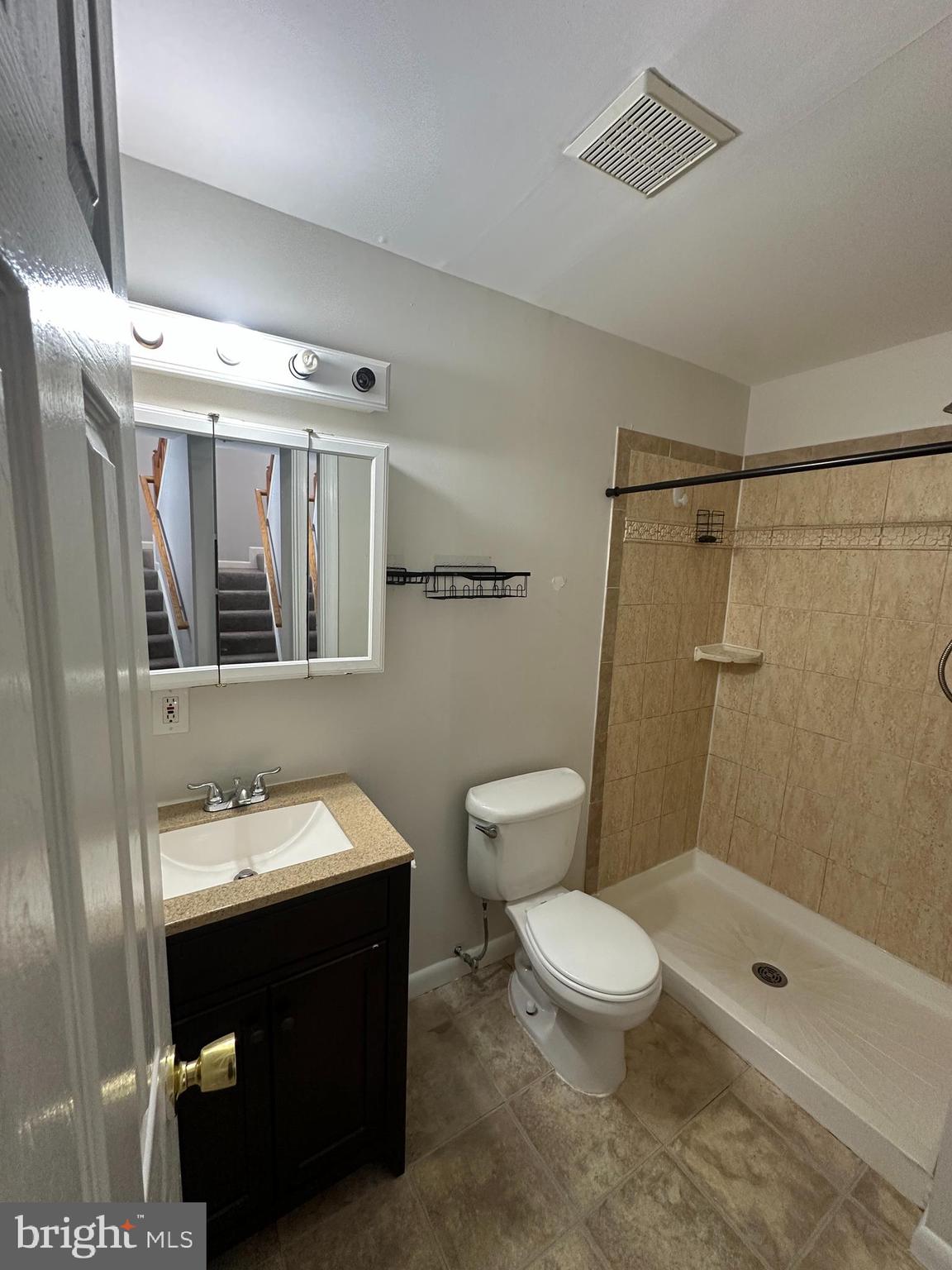 7 Drumcastle Court Germantown, MD 20876 - Photo 16 of 17 a bathroom with a sink a toilet and shower