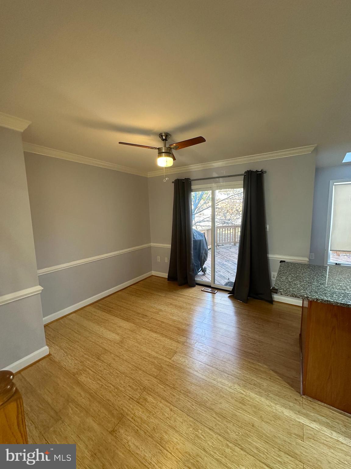 7 Drumcastle Court Germantown, MD 20876 - Photo 5 of 17 a view of an empty room with window and wooden floor
