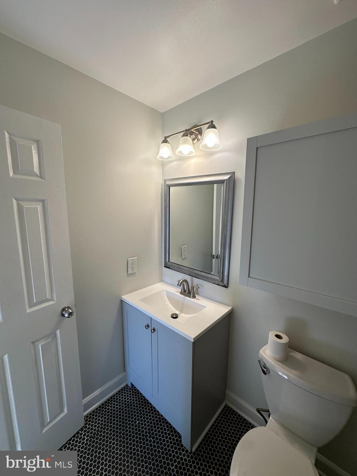 7 Drumcastle Court Germantown, MD 20876 - Photo 9 of 17 a bathroom with a toilet sink and mirror