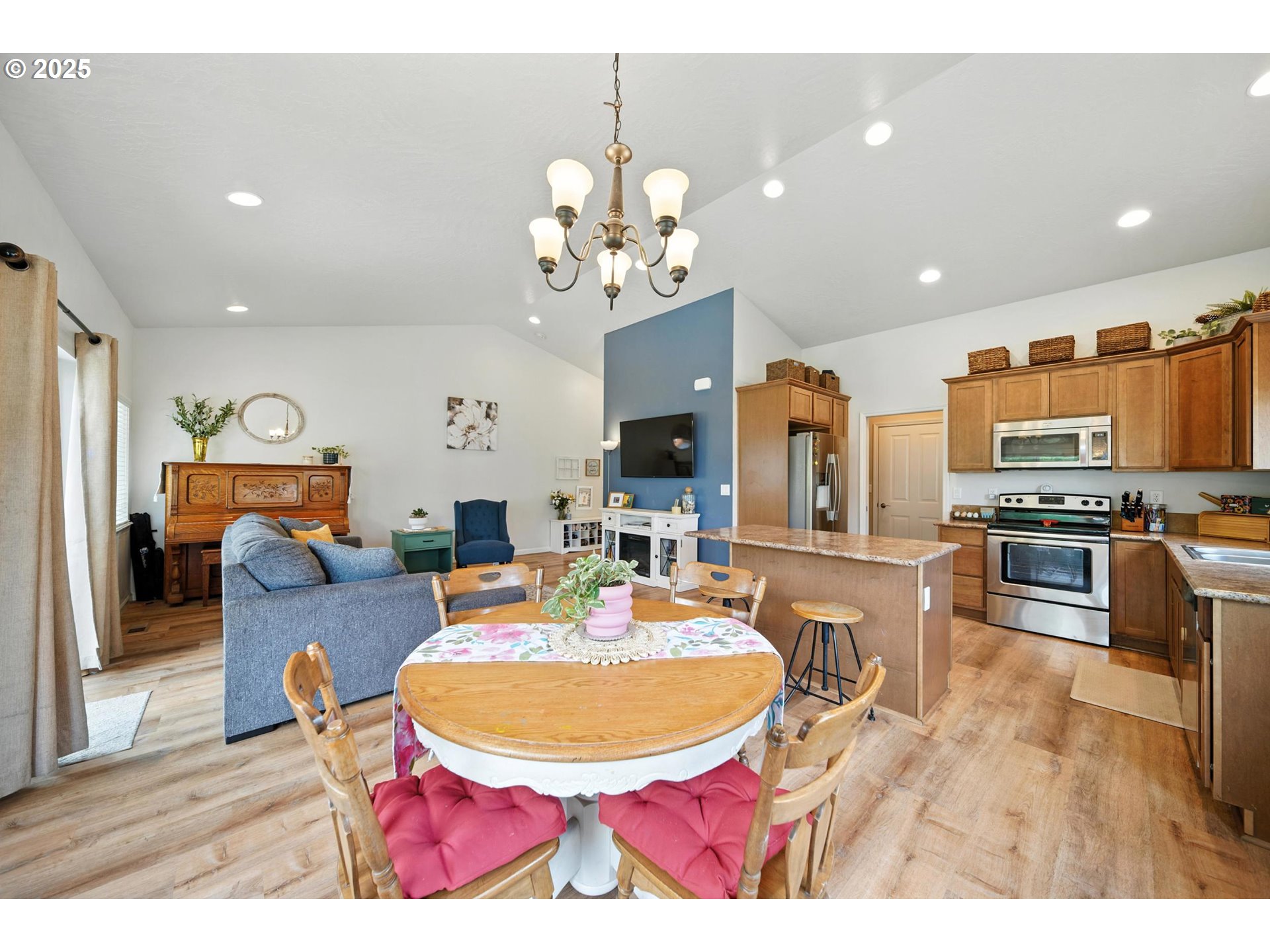 1908 Southwest 2nd Drive Pendleton, OR 97801 - Photo 12 of 40 a living room with fireplace dining table and chairs
