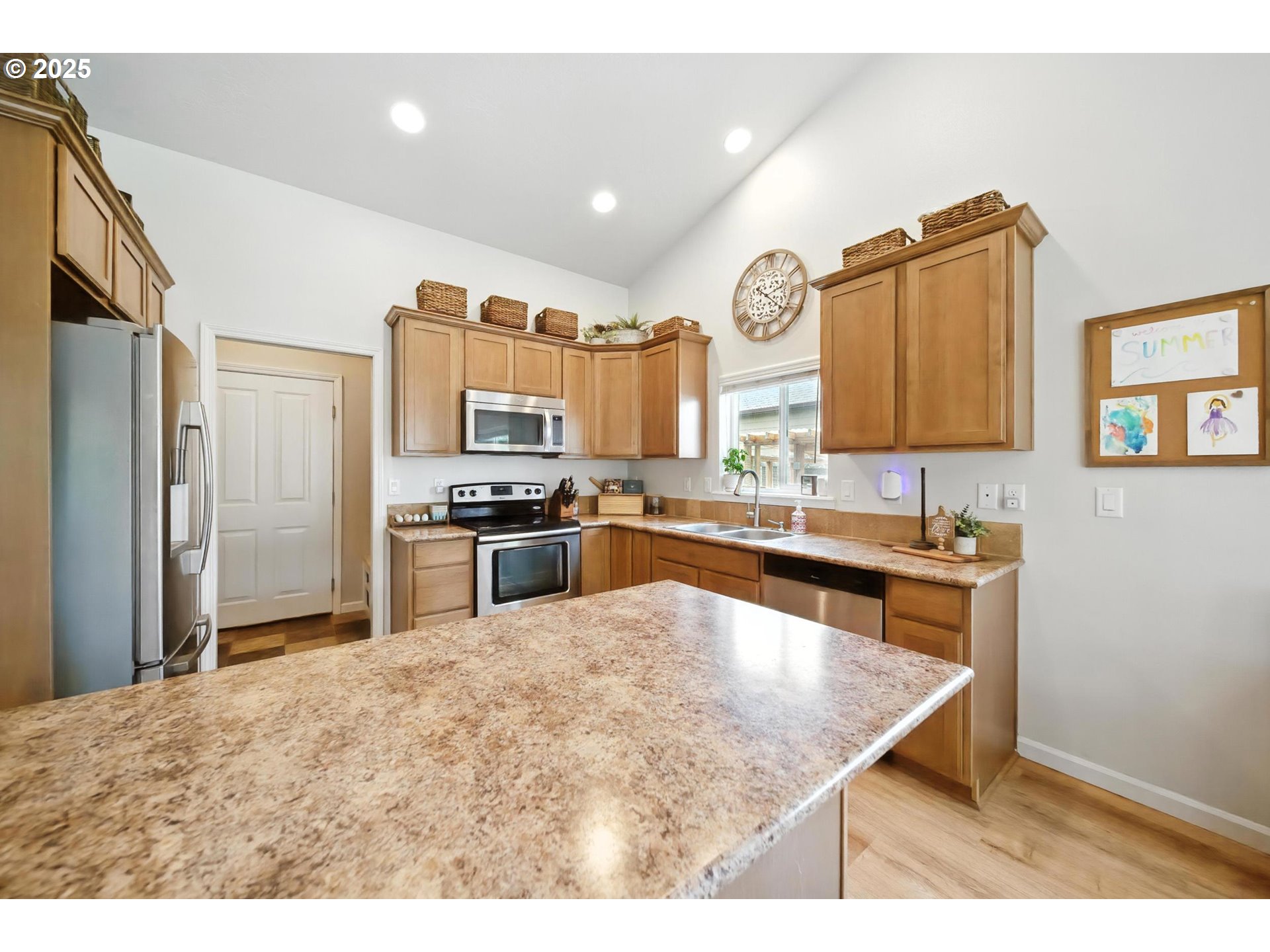 1908 Southwest 2nd Drive Pendleton, OR 97801 - Photo 14 of 40 a kitchen with stainless steel appliances granite countertop a refrigerator a sink and a stove