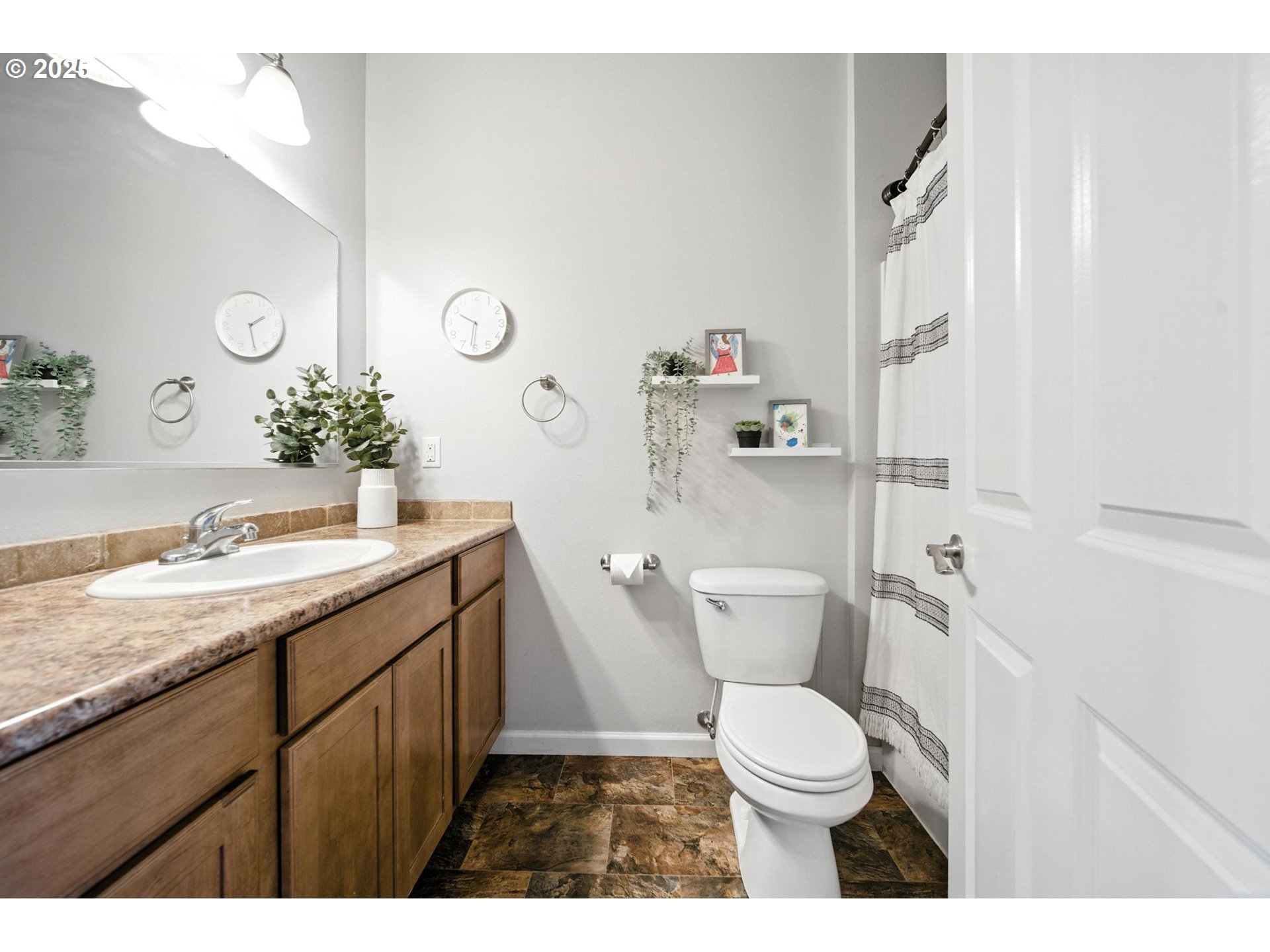 1908 Southwest 2nd Drive Pendleton, OR 97801 - Photo 20 of 40 a bathroom with a granite countertop toilet sink and mirror