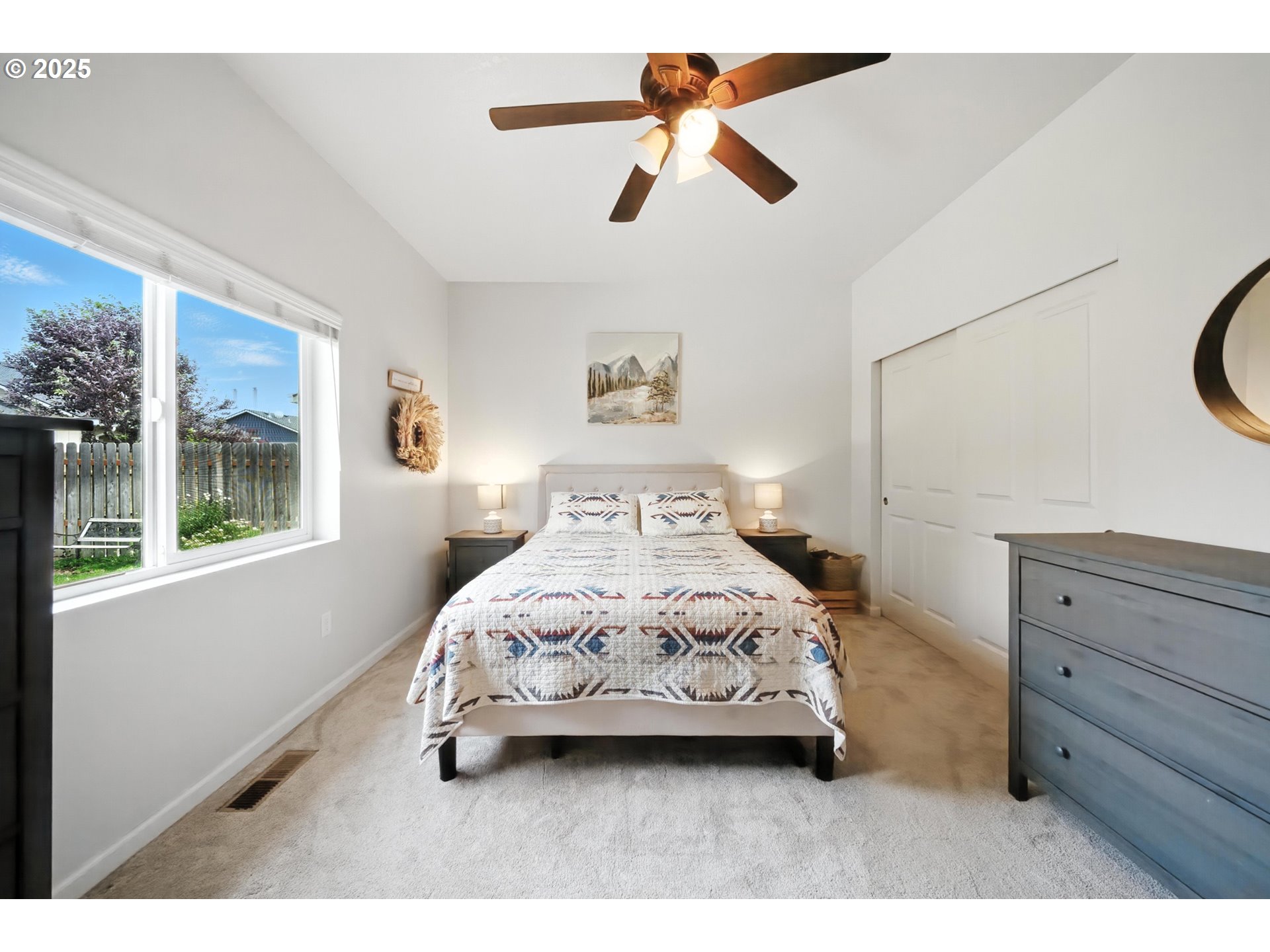 1908 Southwest 2nd Drive Pendleton, OR 97801 - Photo 25 of 40 a bedroom with a bed a chandelier and a window
