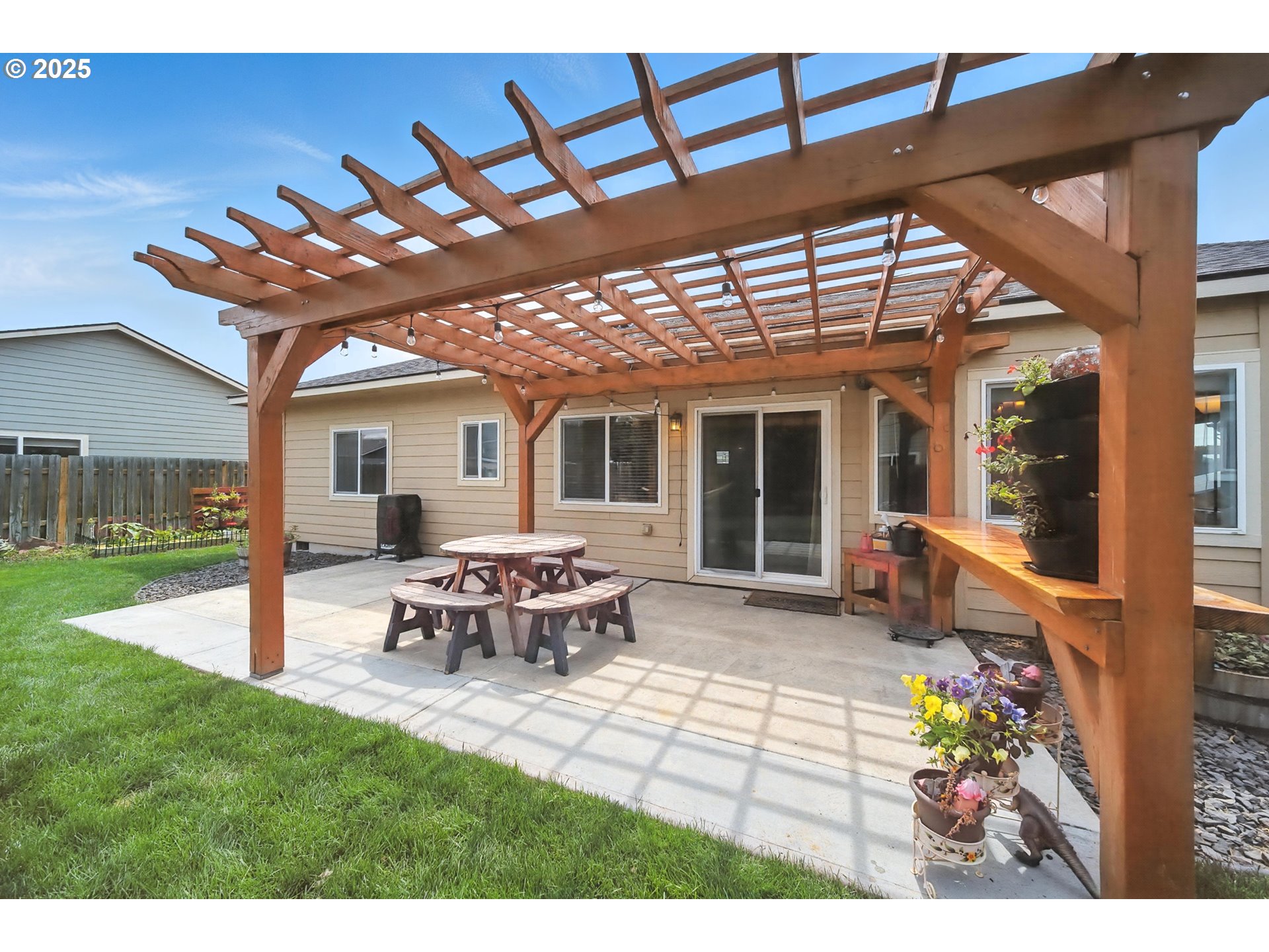 1908 Southwest 2nd Drive Pendleton, OR 97801 - Photo 30 of 40 a view of a house with backyard sitting area and garden