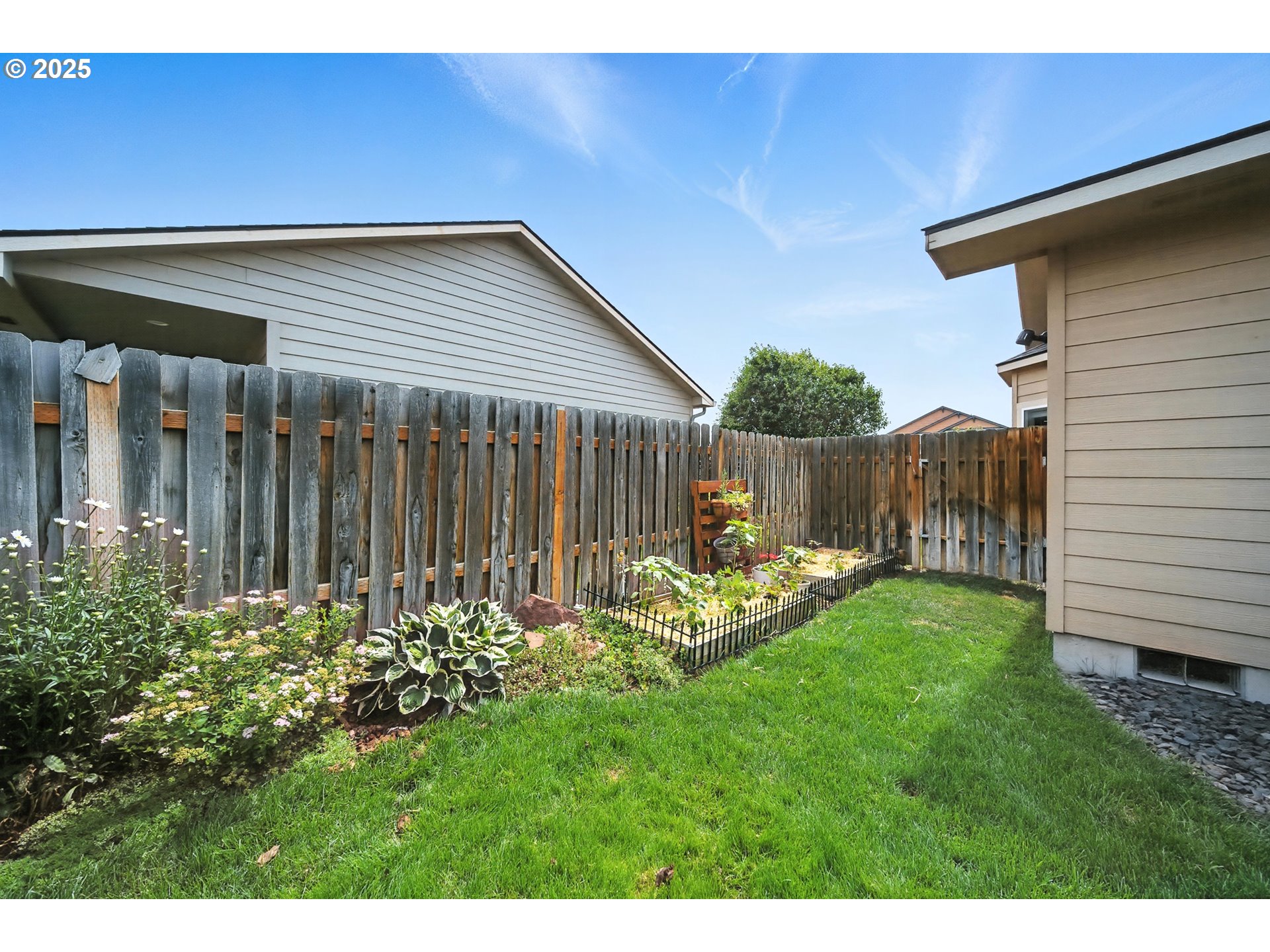 1908 Southwest 2nd Drive Pendleton, OR 97801 - Photo 37 of 40 a view of a backyard with table and chairs and wooden fence