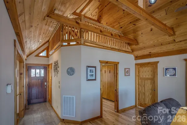 a living room with furniture a wooden floor and a window