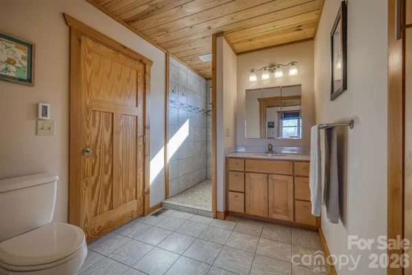 a view of a room with wooden floor and a window