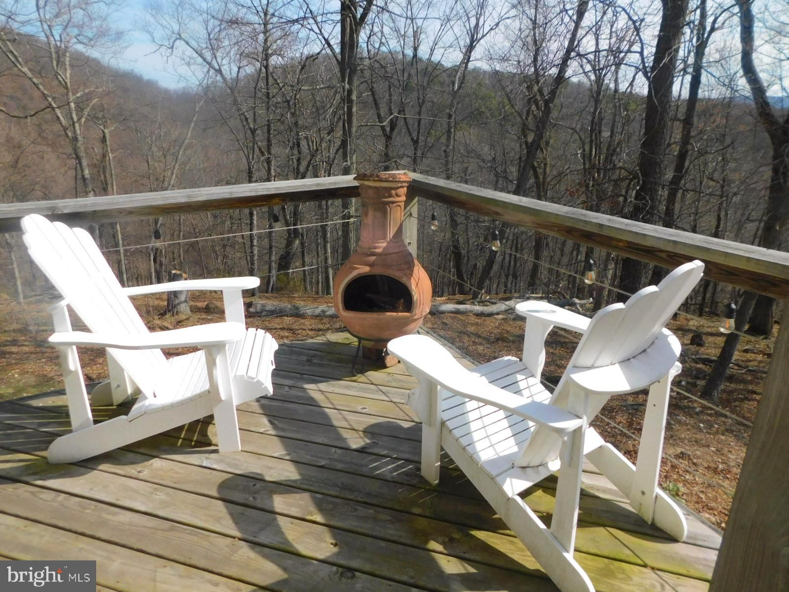 6751 High Knob Road Old Fields, WV 26845 - Photo 20 of 26 a view of a chairs and table on the roof deck