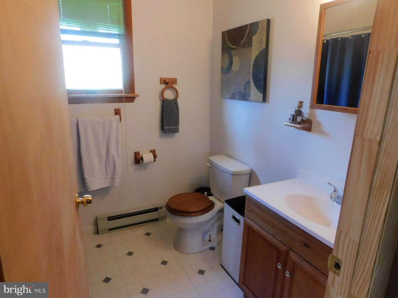 6751 High Knob Road Old Fields, WV 26845 - Photo 9 of 26 a bathroom with a sink toilet and shower