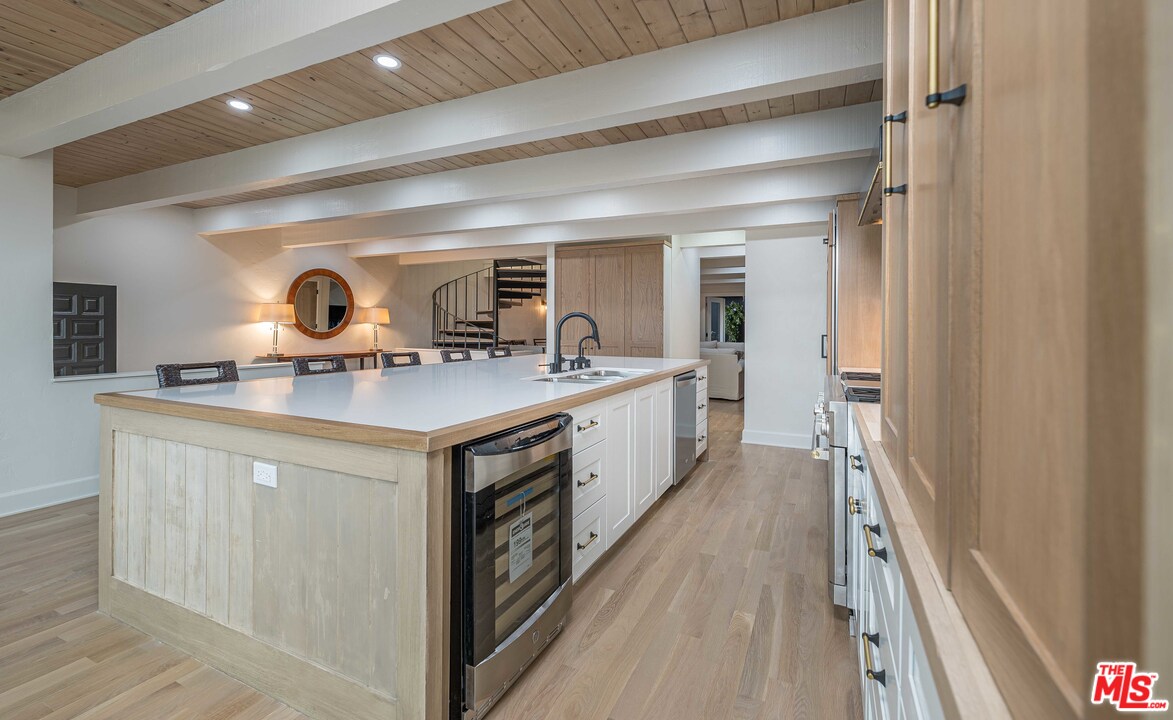6501 Esplanade Playa del Rey, CA 90293 - Photo 12 of 54 a kitchen with stainless steel appliances granite countertop a sink and a stove