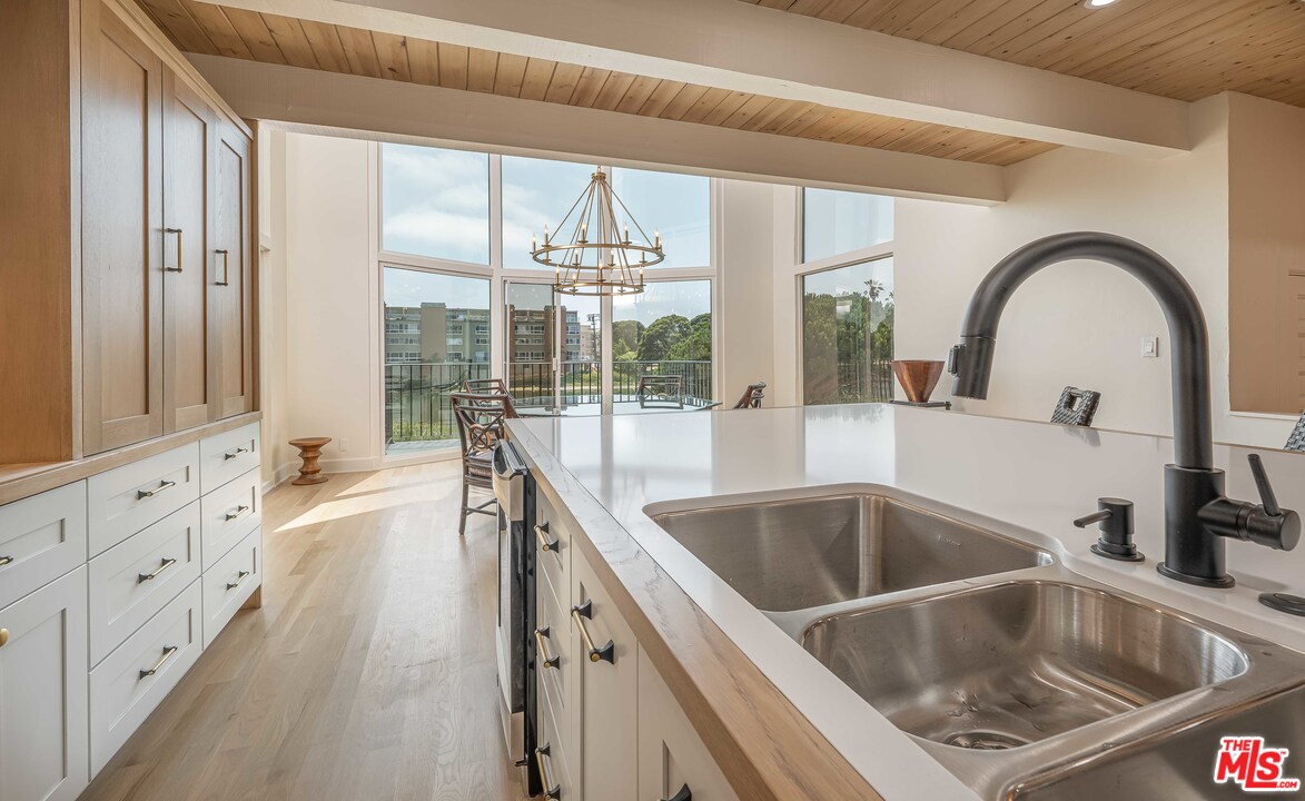 6501 Esplanade Playa del Rey, CA 90293 - Photo 17 of 54 a kitchen with a sink and a wooden floor
