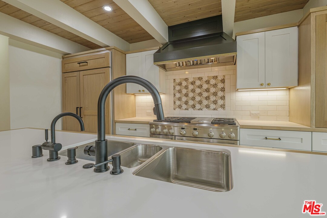 6501 Esplanade Playa del Rey, CA 90293 - Photo 18 of 54 a close view of a sink a faucet and a stove in a kitchen