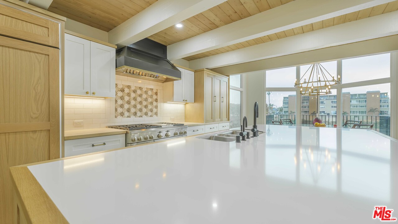 6501 Esplanade Playa del Rey, CA 90293 - Photo 20 of 54 a large white kitchen with a large window