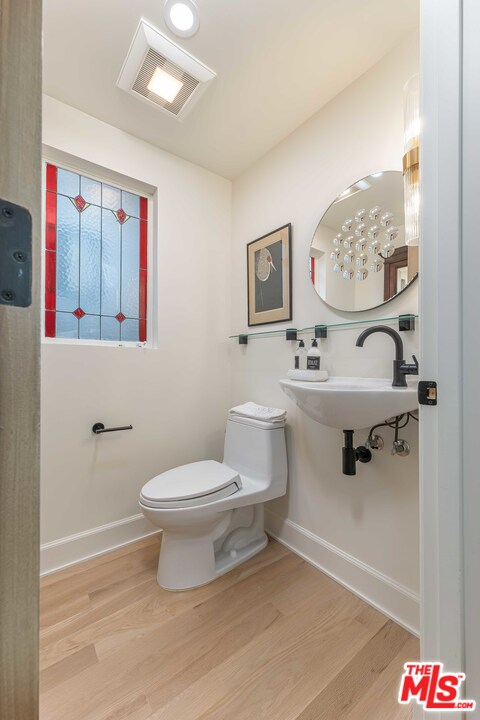 6501 Esplanade Playa del Rey, CA 90293 - Photo 21 of 54 a bathroom with a toilet a sink and a mirror
