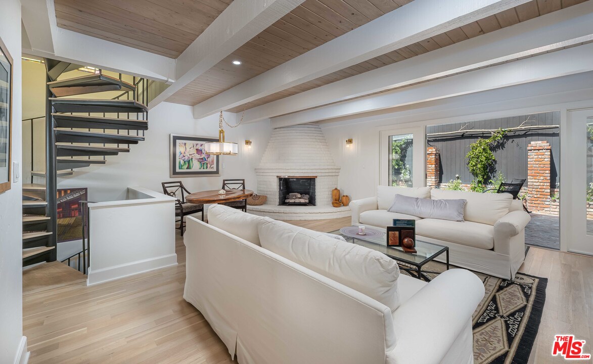 6501 Esplanade Playa del Rey, CA 90293 - Photo 23 of 54 a living room with furniture and a fireplace