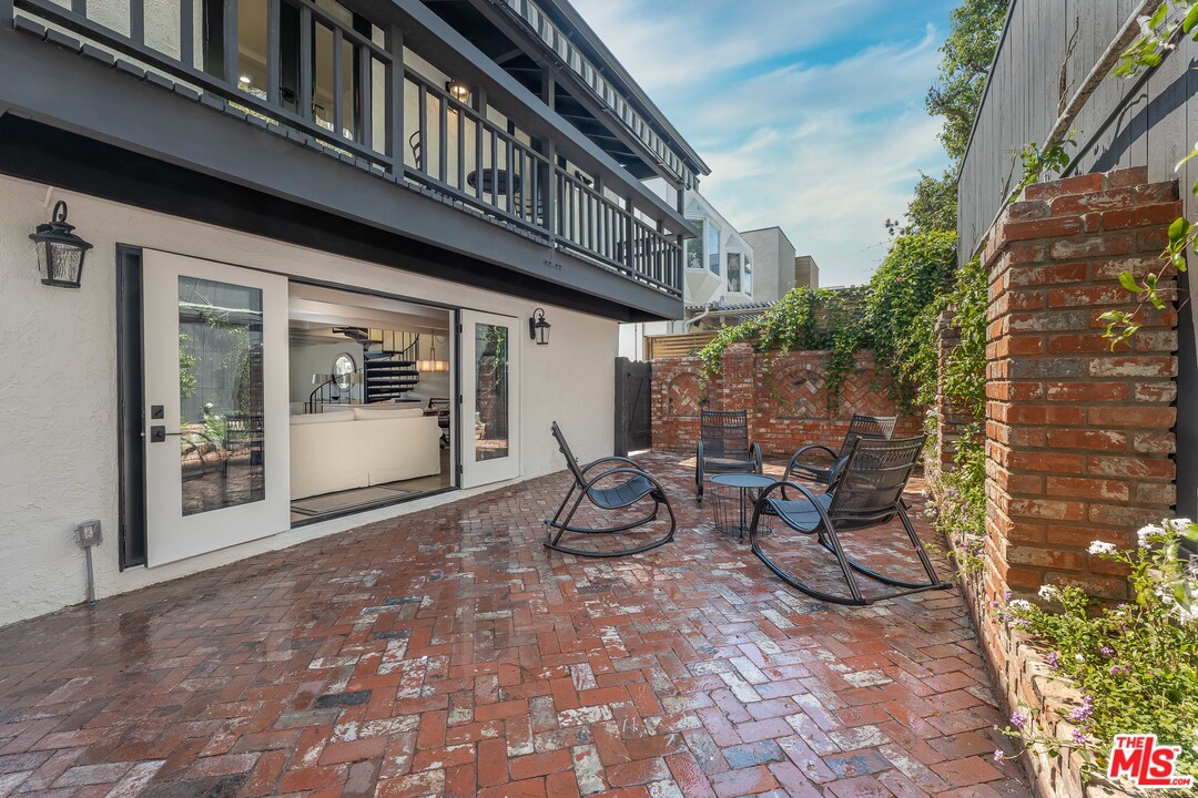 6501 Esplanade Playa del Rey, CA 90293 - Photo 25 of 54 a view of a patio with table and chairs and potted plants
