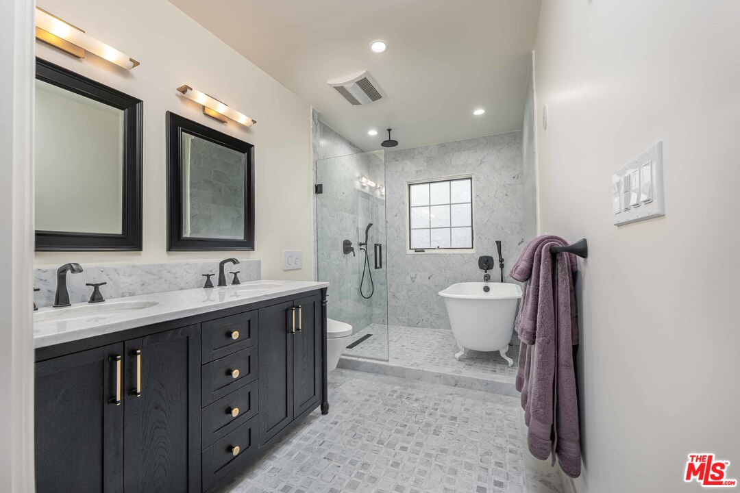 6501 Esplanade Playa del Rey, CA 90293 - Photo 33 of 54 a view of bathroom with a toilet sink mirror and vanity