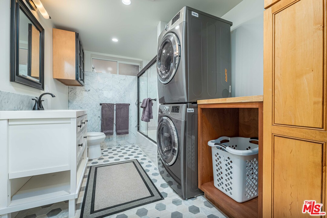 6501 Esplanade Playa del Rey, CA 90293 - Photo 43 of 54 a bathroom with a sink a mirror and a shower curtain