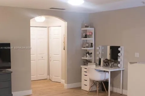 a view of a kitchen from the hallway