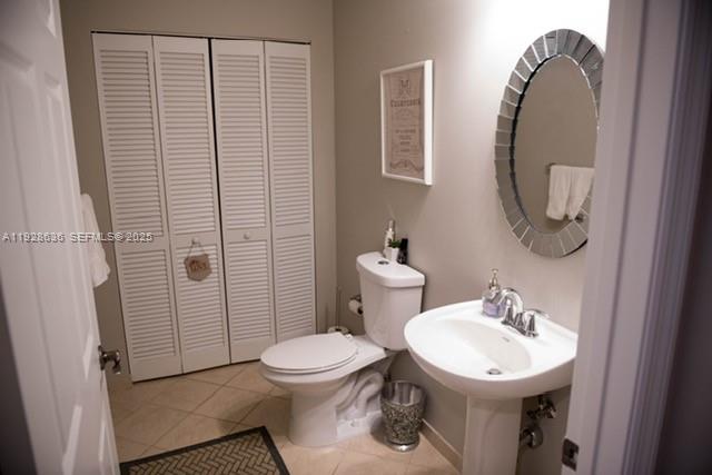 8395 Southwest 73rd Avenue, Unit 105 Miami, FL 33143 - Photo 7 of 14 a white toilet sitting next to a bathroom sink