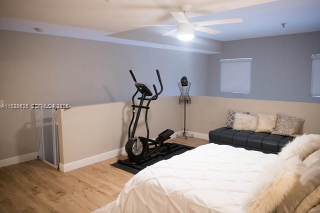 8395 Southwest 73rd Avenue, Unit 105 Miami, FL 33143 - Photo 10 of 14 a bedroom with a bed and a ceiling fan