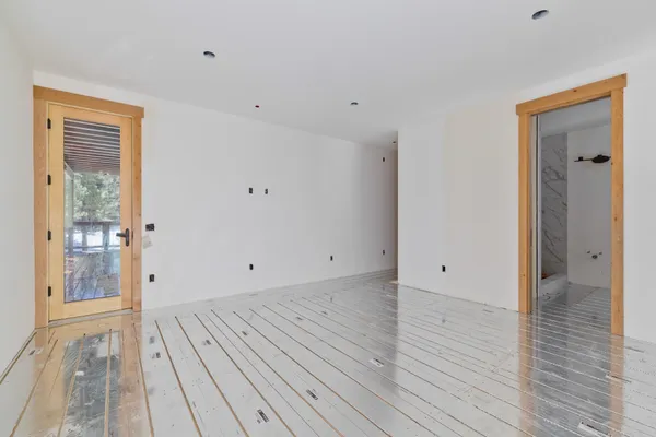 a view of a balcony with furniture and wooden floor