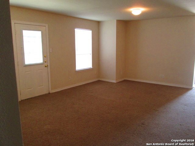 10003 Vasso View, Unit 4 Converse, TX 78109 - Photo 3 of 10 an empty room with a window