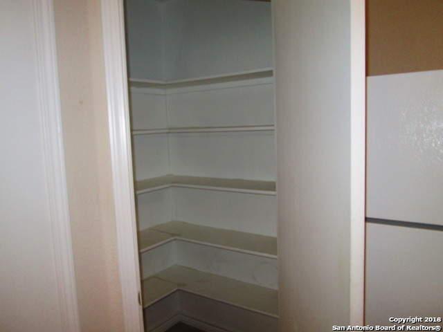 10003 Vasso View, Unit 4 Converse, TX 78109 - Photo 7 of 10 a view of walk in closet with empty racks