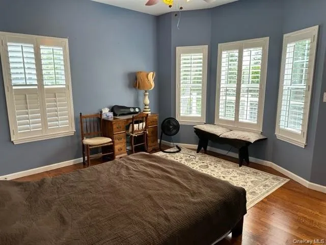 a bedroom with furniture and a window