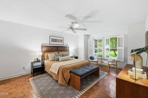 a bedroom with a bed and a couch