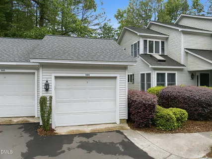 front view of a house with a garden