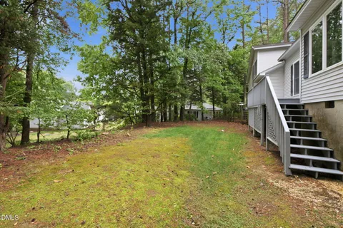 an aerial view of a house with a lake view