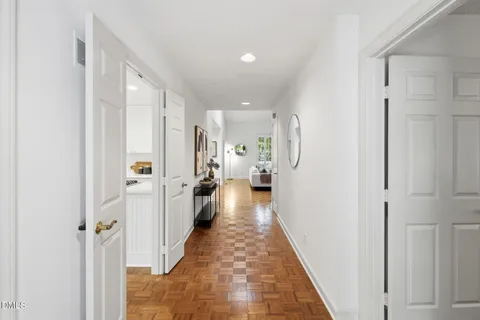 a view of a hallway with white walls