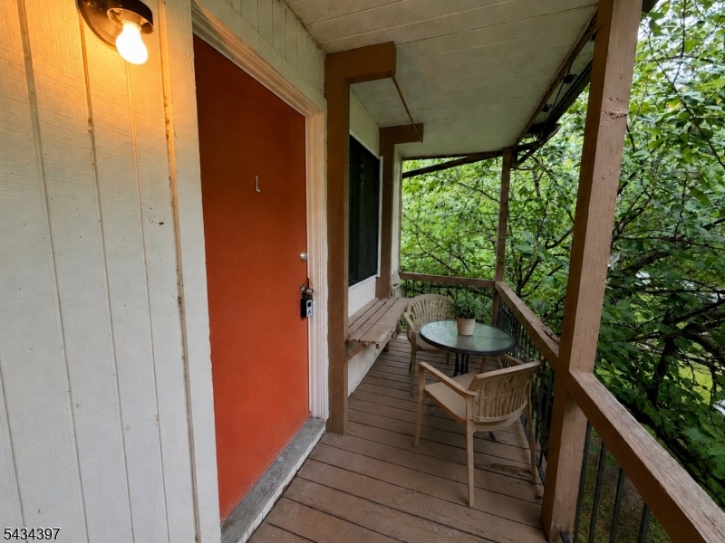 207 Old Chimney Ridge Road, Unit L Montague, NJ 07827 - Photo 2 of 14 a balcony with chairs