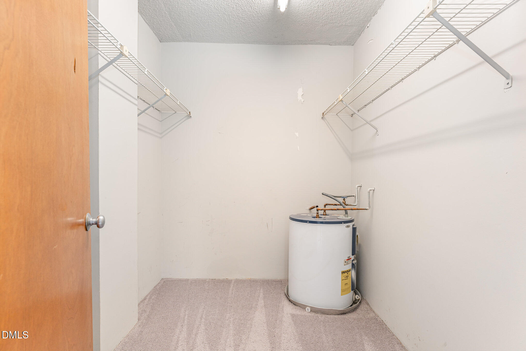 4700 Westgrove Street, Unit 216 Raleigh, NC 27606 - Photo 15 of 21 a view of a storage & utility room with racks on the wall