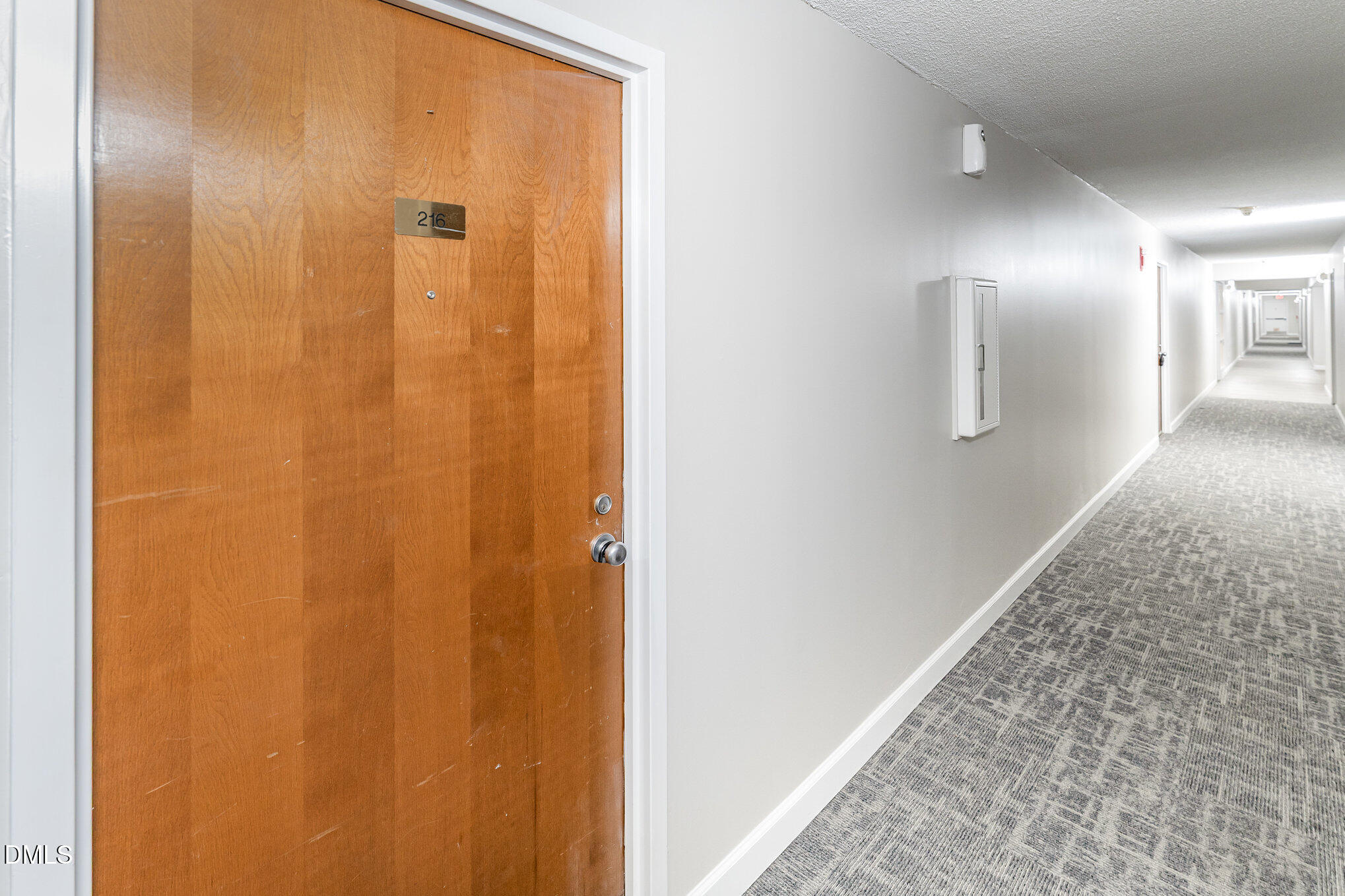 4700 Westgrove Street, Unit 216 Raleigh, NC 27606 - Photo 4 of 21 a view of a hallway with wooden floor