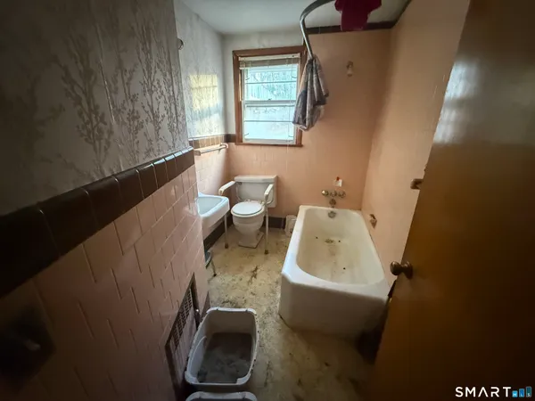 a bathroom with a sink and toilet