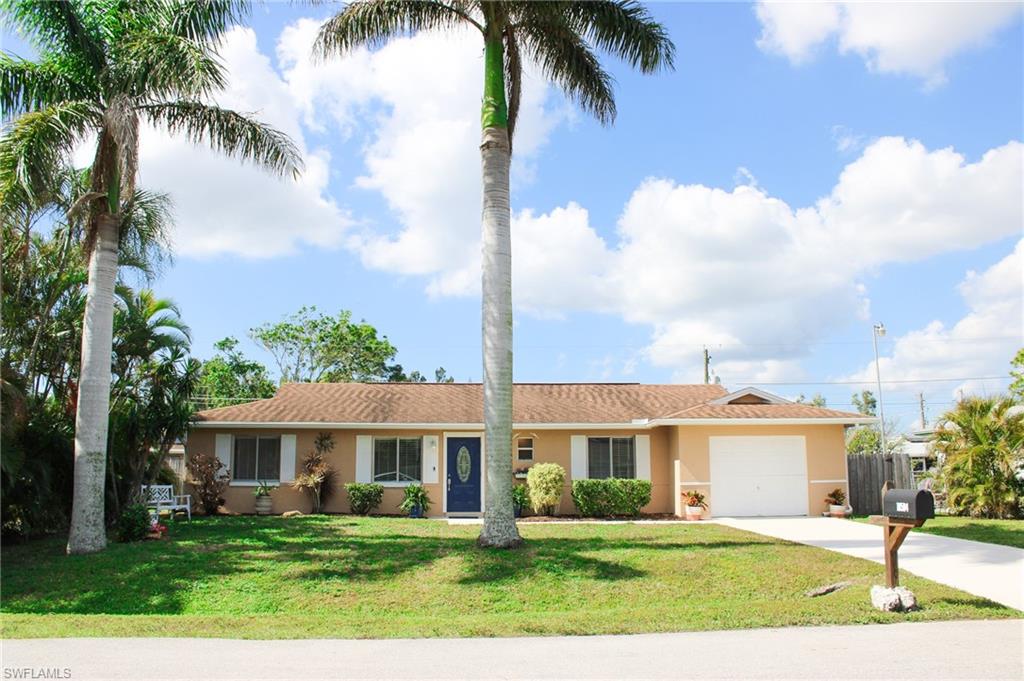 18584 Sebring Road Fort Myers, FL 33967 - Photo 1 of 25 Ranch-style house featuring a garage and a front yard