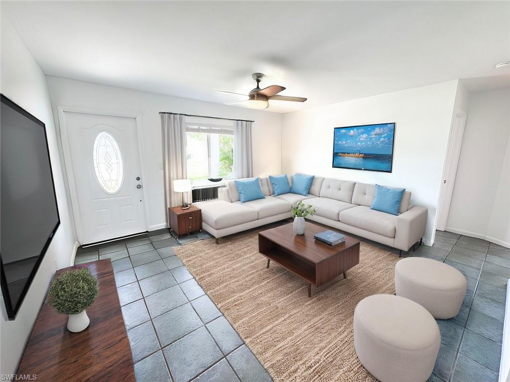 18584 Sebring Road Fort Myers, FL 33967 - Photo 8 of 25 Living room with tile patterned floors and ceiling fan. This photo has been virtually staged.