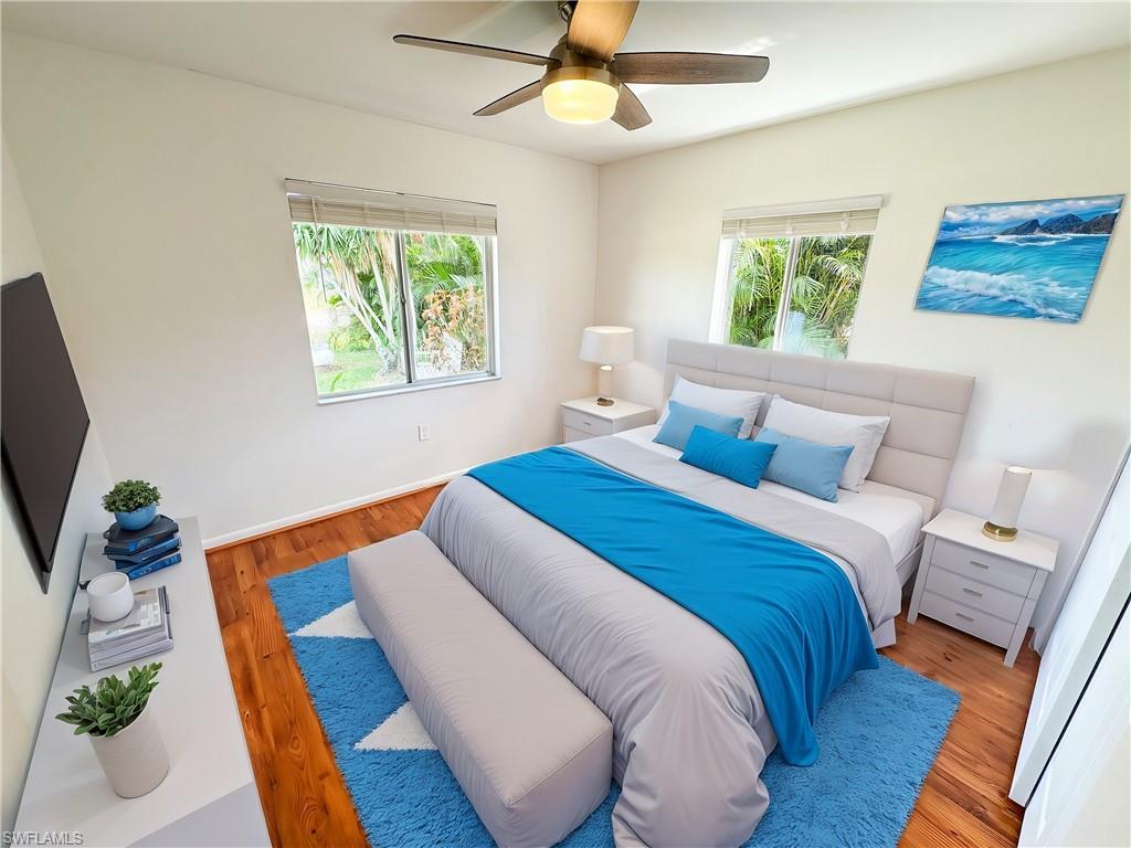 18584 Sebring Road Fort Myers, FL 33967 - Photo 9 of 25 Bedroom with ceiling fan and light hardwood / wood-style floors. This photo has been virtually staged.