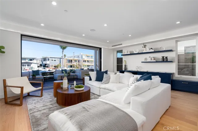 a spacious bedroom with a bed and a potted plant