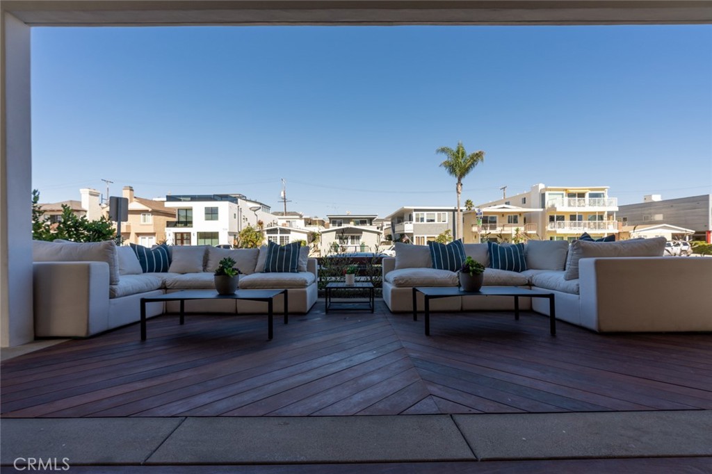 1025 West Balboa Boulevard Newport Beach, CA 92661 - Photo 20 of 70 a living room with furniture and a fireplace
