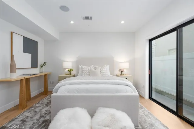 a bedroom with a bed and a couch