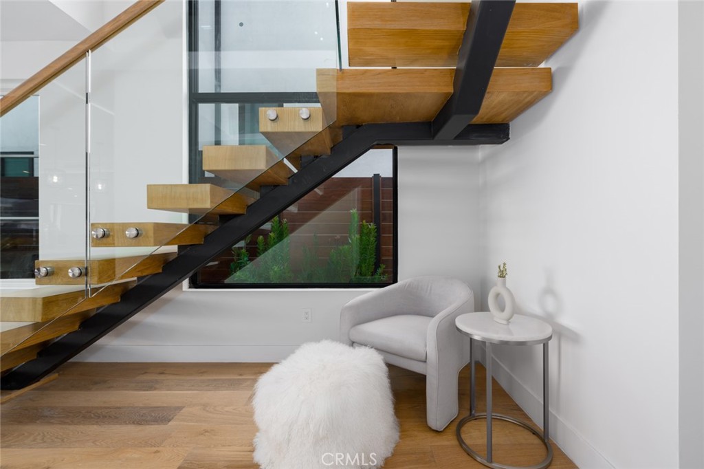 1025 West Balboa Boulevard Newport Beach, CA 92661 - Photo 32 of 70 a living room with chairs and stairs