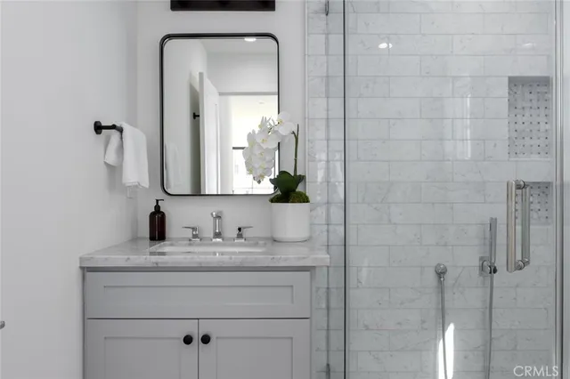 a living room with furniture and a lamp