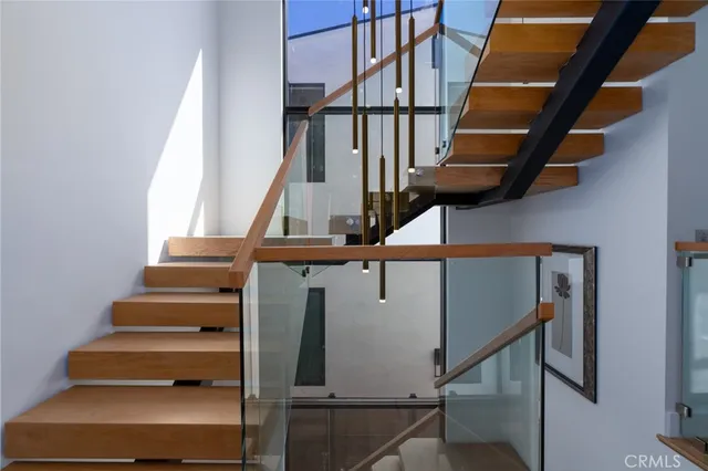 a view of a house with backyard sitting area and furniture