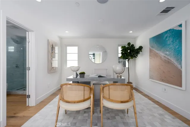 a kitchen with a table and chairs in it